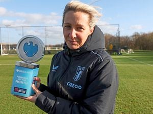 Villa Women boss Carla Ward with her manager of the month trophy at their Bodymoor Heath training complex.