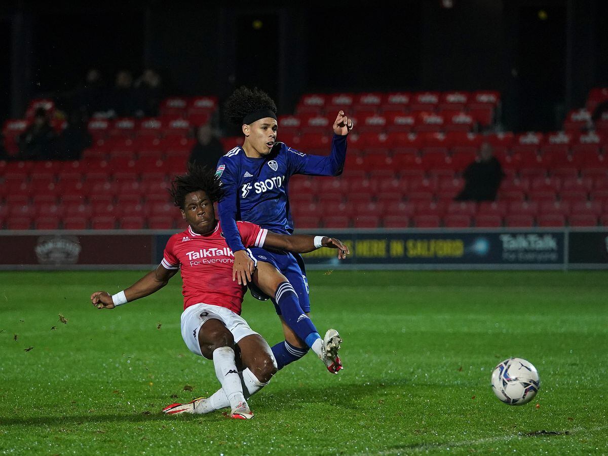 Salford City's Brandon Thomas-Asante scores his teams first goal past Leeds United U21's Jeremiah Mullen during the Papa John's Trophy Northern Group B match at Moor Lane, Salford. Picture date: Tuesday November 2, 2021..