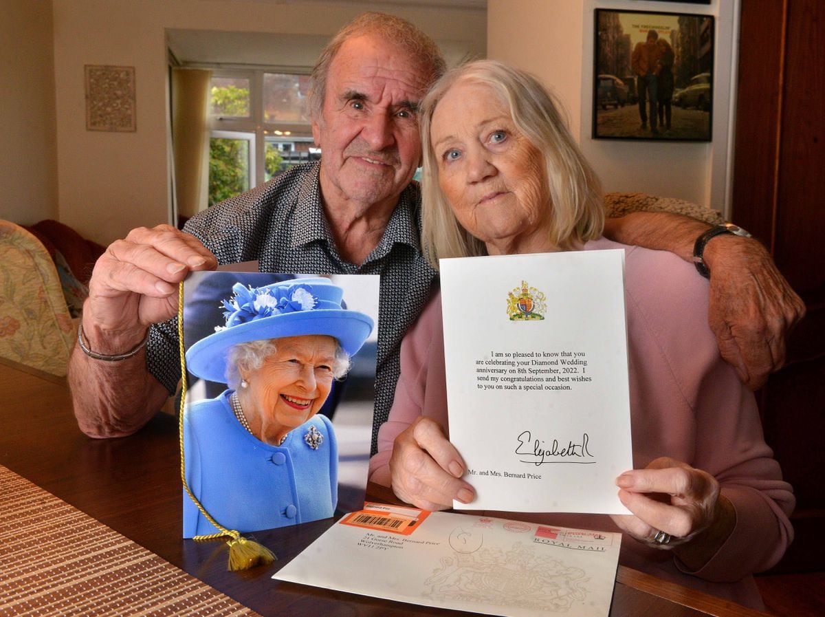 Margaret and Bernard Price with the congratulatory card they received from the Queen on Wednesday to celebrate their diamond wedding anniversary
