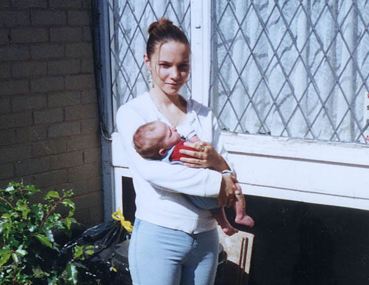 Natalie Putt holds her son Rhys McCallum who was 11 weeks old when she disappeared