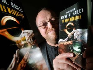WOLVERHAMPTON COPYRIGHT SHROPSHIRE STAR STEVE LEATH 27/01/2023..Pic in Willenhall of author: Wayne Bailey, with his book he has written..a Sci Fi story called: The Mars Migration..