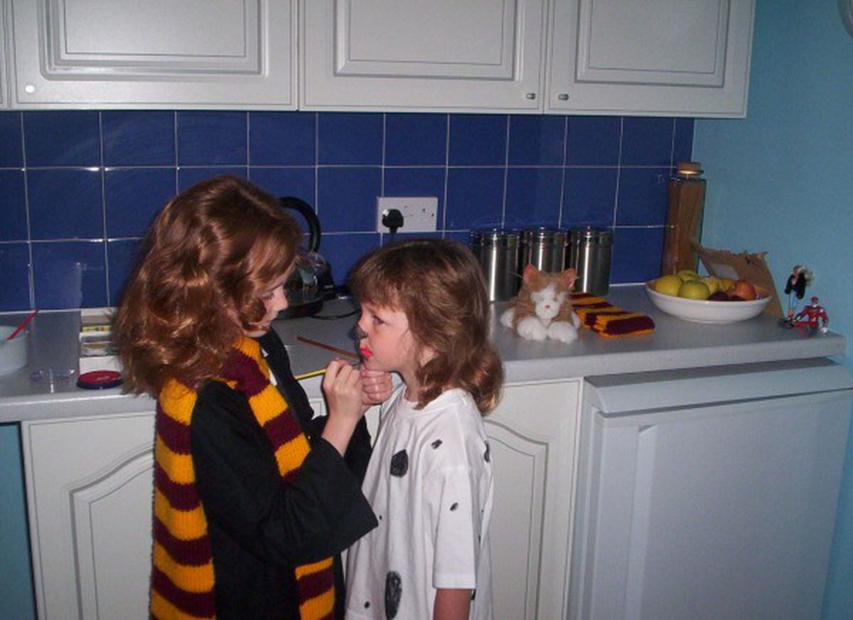 Chloe, aged around seven, left, wearing her Harry Potter scarf