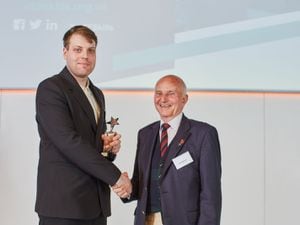John Eastman (President IRTE and SOE) (right) presents the award to Pawel Dudziec