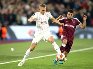 West Ham United's Pablo Fornals (right) and Sevilla's Ludwig Augustinsson (left) during the UEFA Europa League round of sixteen second leg match at the London Stadium. Picture date: Thursday March 17, 2022..