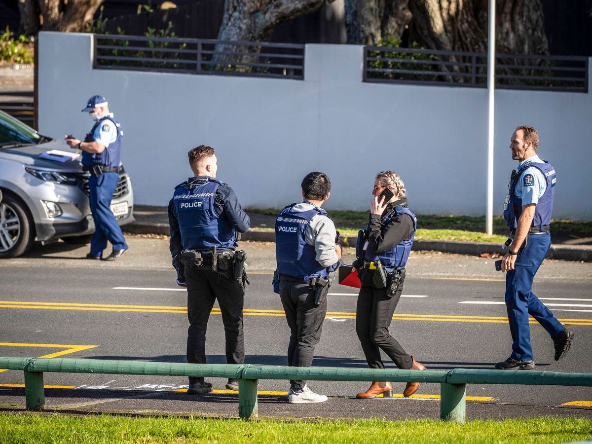 Police set up cordons and search area around a suburb of Auckland following reports of multiple stabbings in New Zealand