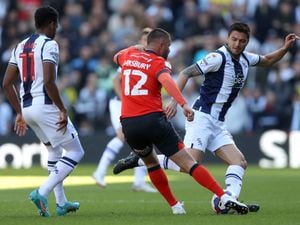 Okay Yokuslu of West Bromwich Albion and Henri Lansbury of Luton Town during the Sky Bet Championship between West Bromwich Albion and Luton Town at The Hawthorns on October 8, 2022 in West Bromwich, United Kingdom. (Photo by Adam Fradgley/West Bromwich Albion FC via Getty Images).