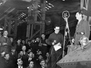 The Free French leader addresses workers at the English Electric Co factory in Stafford on Wednesday, October 22, 1941.
