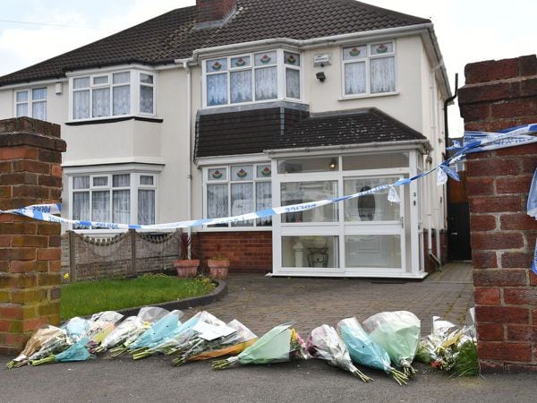 Flowers outside the house on Boundary Avenue in Rowley Regis after Lucille Downer's death