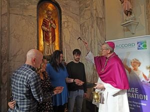 Bishop Denis Nulty blessing engaged couples (left to right) Ilona Catharine Dorrepaal and Patrick Michael Lennon, and Orla Gavin and Patrick Corcoran, at the shrine of the holy relics of Saint Valentine in the Carmelite Church in Dublin city