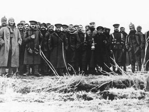 German and British troops mingle on Christmas Day, 1914.