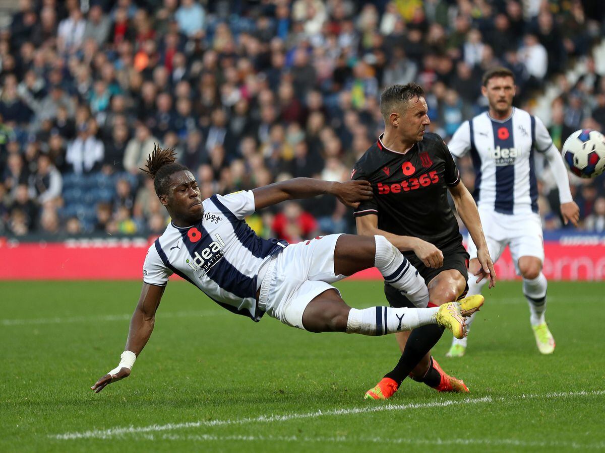 Brandon Thomas-Asante of West Bromwich Albion and Phil Jagielka of Stoke City during the Sky Bet Championship between West Bromwich Albion and Stoke City at The Hawthorns on November 12, 2022 in West Bromwich, United Kingdom. (Photo by Adam Fradgley/West Bromwich Albion FC via Getty Images).