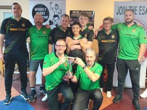 The Wolves Squad receive the UK and Ireland Team League Trophy.  