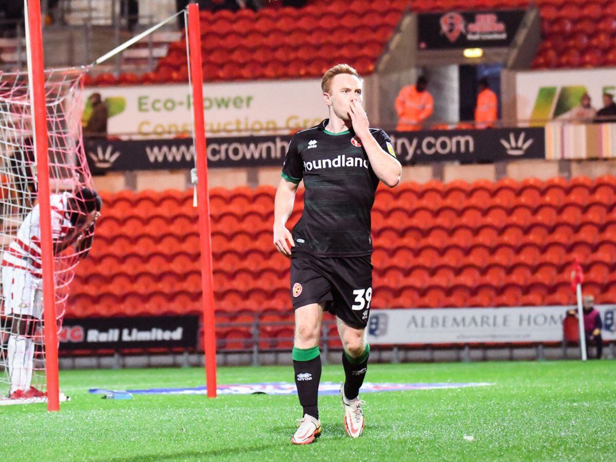 Danny Johnson celebrates in front of the travelling fans after grabbing a second (Owen Russell)