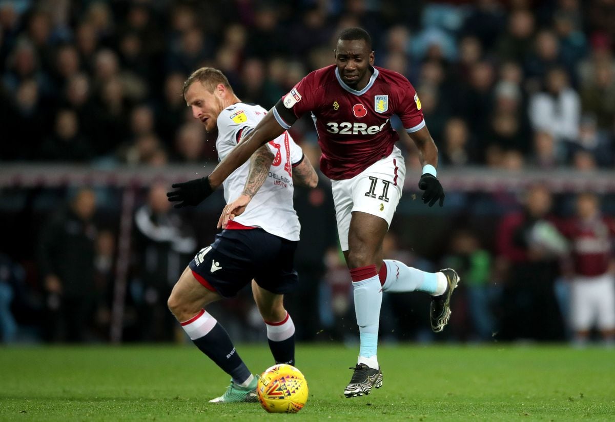 Bolton Wanderers' David Wheater (left) and Aston Villa's Yannick Bolasie battle for the ball.
