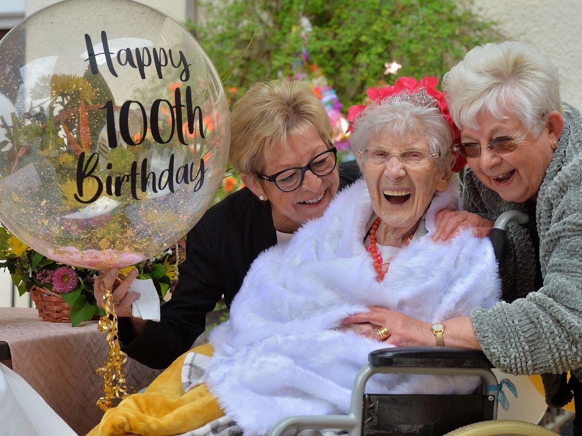Edna Hill, celebrating her 100th birthday at Bearwood Nursing Home. She is pictured with her daughters, Beverley Knight and Marilyn Hodgkins