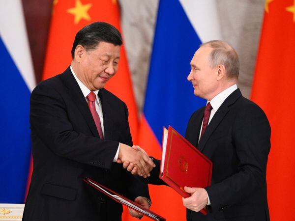 Russian President Vladimir Putin, right, and Chinese President Xi Jinping following talks in Moscow
