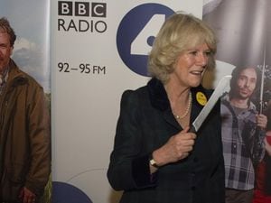 The then Duchess of Cornwall prepares to cut a cake which celebrates 60 years of The Archers during a visit to BBC Birmingham back in 2011