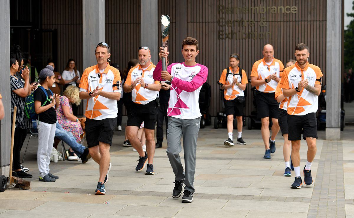 Callum Chadwick was first to carry the baton at the National Memorial Arboretum 