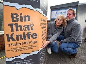 Beverley and Mark Brindley, parents of James Brindley who was killed by a knife attack, next to the new knife bin in Aldridge High Street