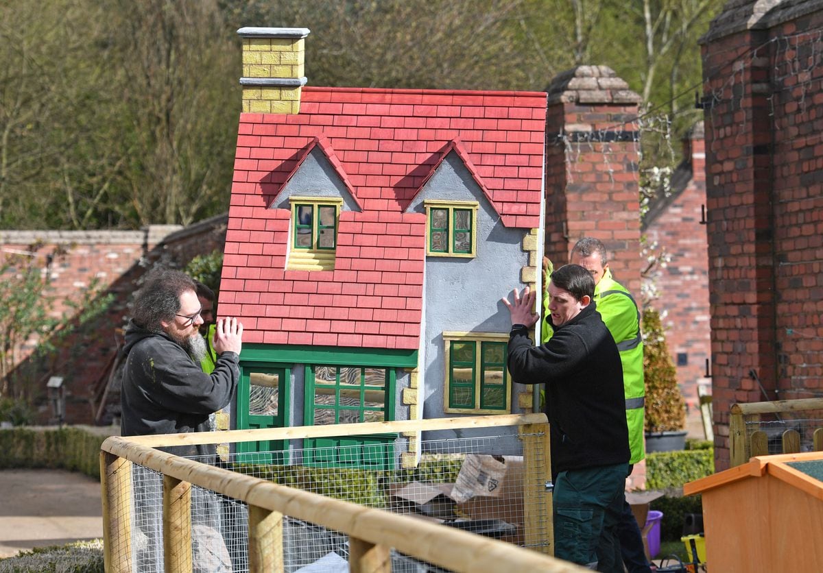 Staff move the giant house hutches into place at the new rabbit village attraction at Sandwell Valley Park