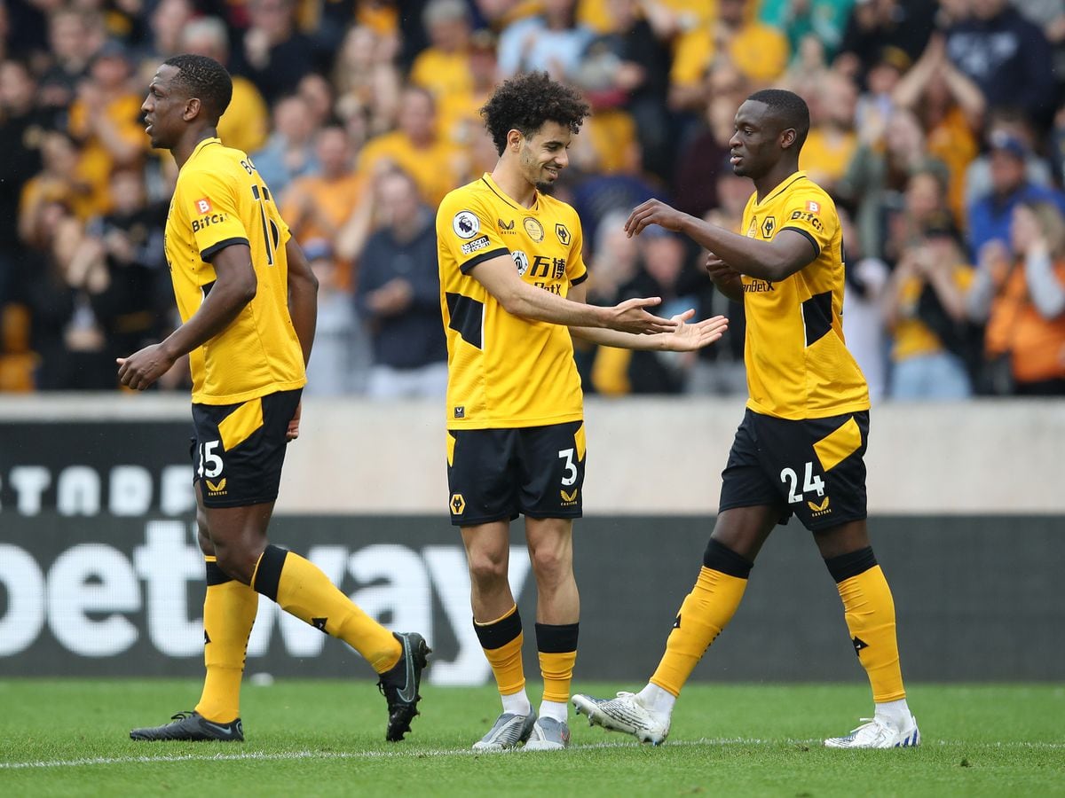 WOLVERHAMPTON, ENGLAND - MAY 15: Rayan Ait-Nouri celebrates with Toti Gomes of Wolverhampton Wanderers after scoring their team's first goal during the Premier League match between Wolverhampton Wanderers and Norwich City at Molineux on May 15, 2022 in Wolverhampton, England. (Photo by Jack Thomas - WWFC/Wolves via Getty Images).