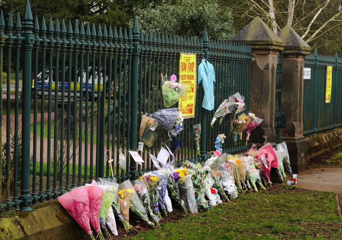 Floral tributes left at one of the gates to West Park after the murder