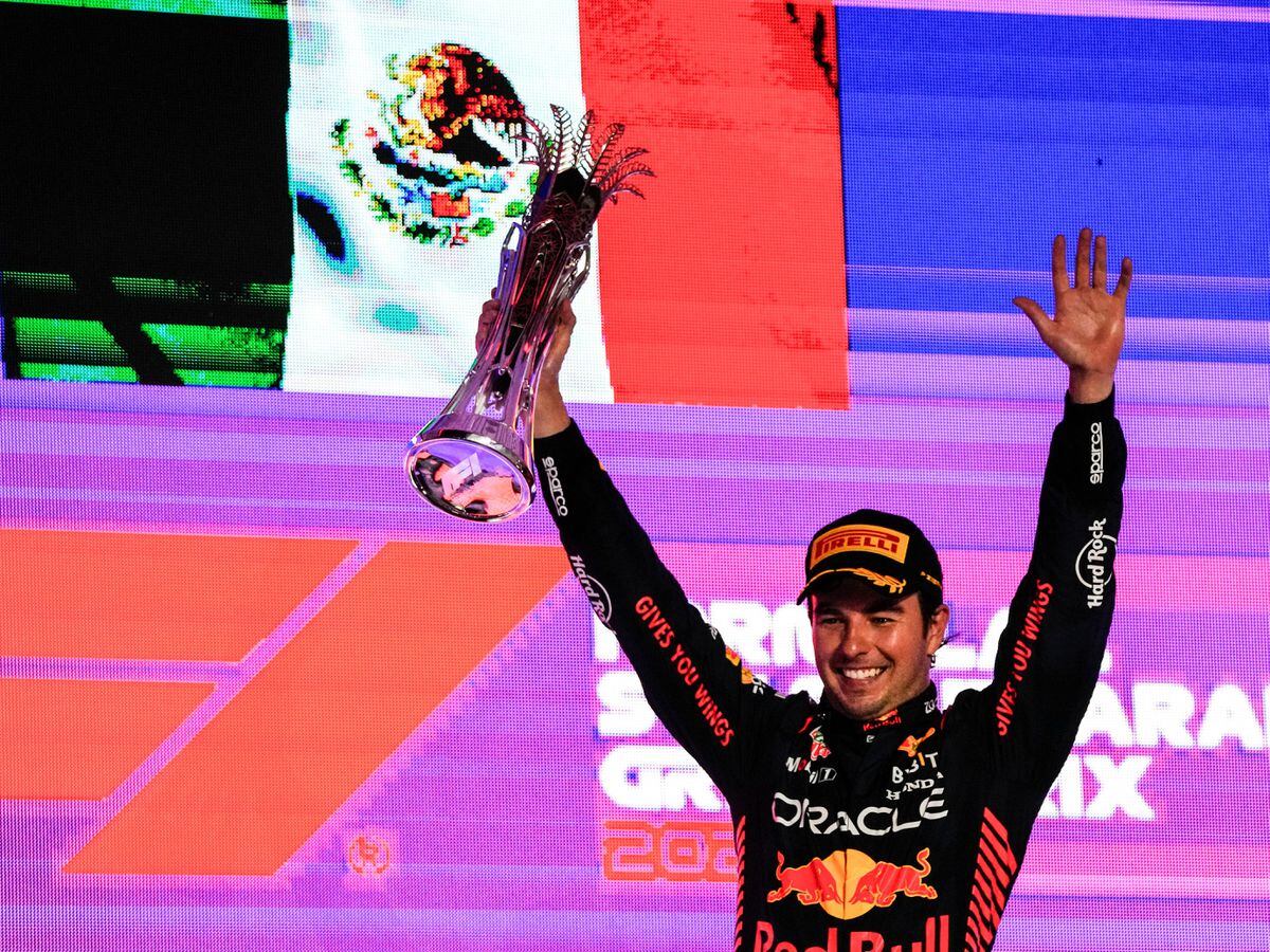Sergio Perez celebrates on the podium