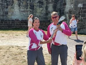 Laura Colclough hands the baton over to Steve Glover at Stafford Castle