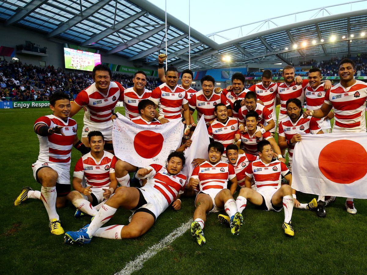 Japan celebrate a Rugby World Cup victory over South Africa