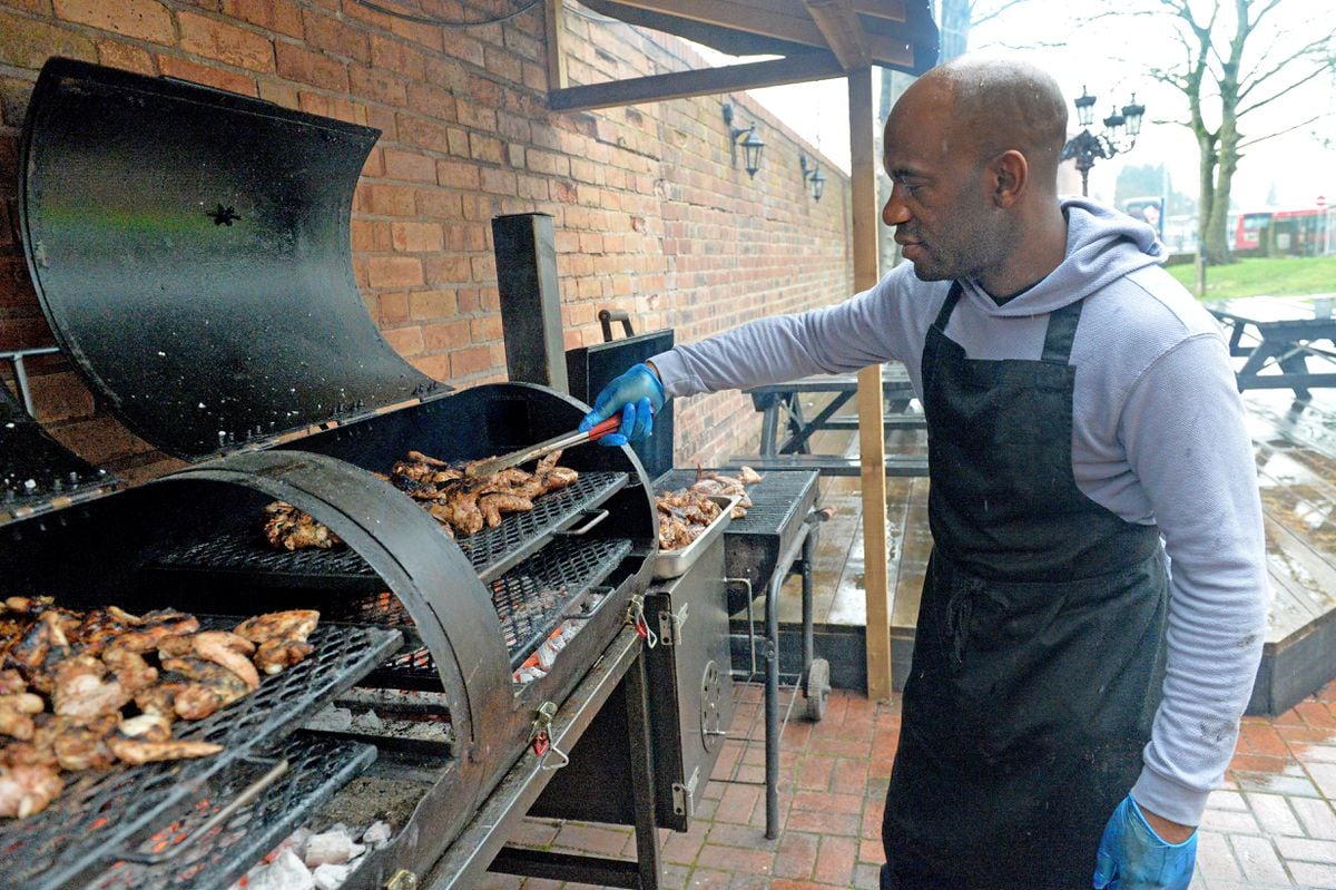 Owner Daren Thompson barbecues the chicken 