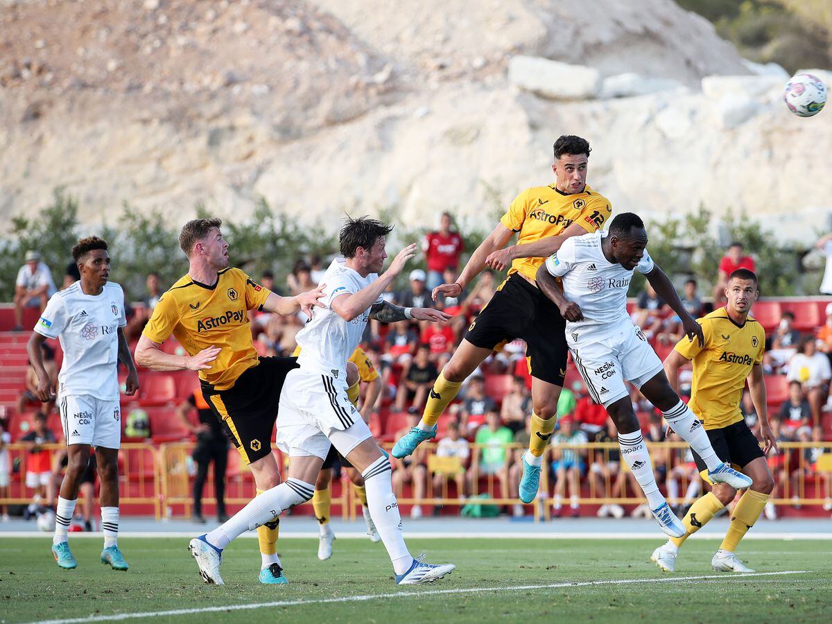 Max Kilman of Wolverhampton Wanderers headers the ball during the Pre-Season Friendly between Besiktas and Wolverhampton Wanderers at Estadio Camilo Cano on July 23, 2022 in Benidorm, Spain. (Photo by Jack Thomas - WWFC/Wolves via Getty Images).
