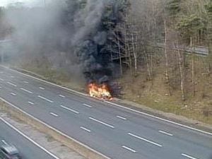 The car on fire, which has caused delays on the M6. Photo: National Highways: West Midlands.