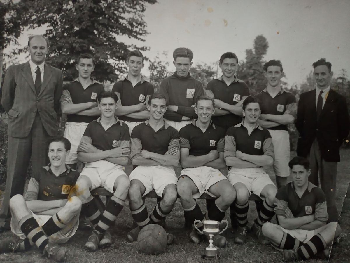 Springfield Road Boys' Club team pictured in 1948: Frank Knowles, sitting down on the left, George Wright, seated with cup, Les Fiddler and Kenny Roberts, with coach Mr Burton on the far right. Do you know who the others are?