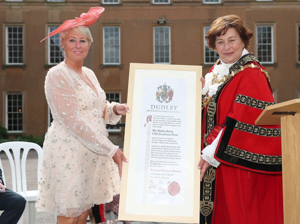 Diane Wake, chief executive of the Dudley Group of Hospitals NHS Trust, receives the freedom scroll from the Mayor of Dudley on behalf of NHS staff