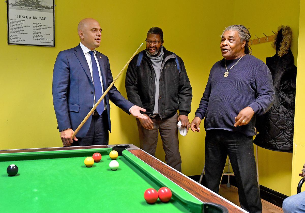 Sajid Javid joins members of the service at the African Caribbean Community Initiative in a game of pool