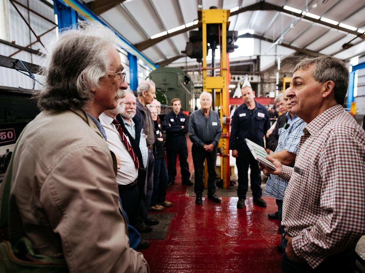 Martin White, head of engineering at the Severn Valley Railway, shows visitors around the new locomotive shed