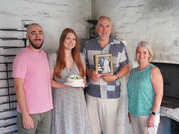 Luke Lawler, Bethany Day, Andy Day and Jayne Pritchard pose inside the recreation of the bakery where Bethany's grandparents had their wedding cake made