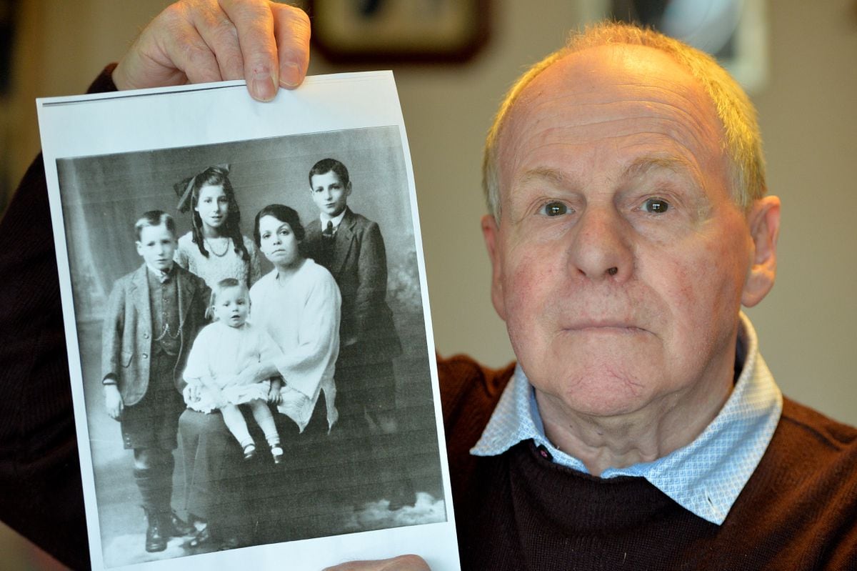 John Bryant holds a picture of his grandmother Florence, who was injured in the explosion, and her surviving children Ted, who was John's father, Mary, Frederick and baby Elsie