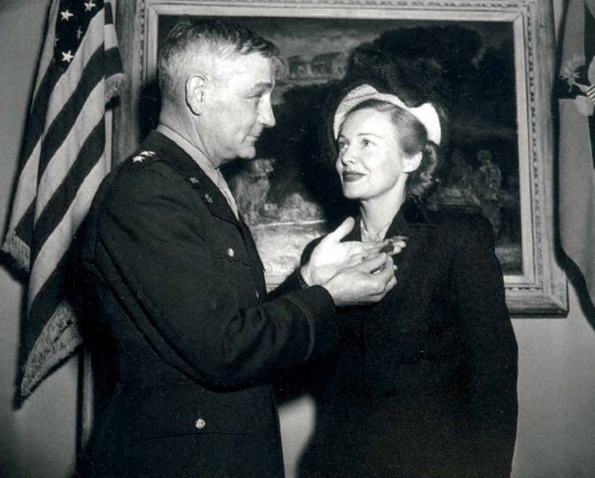 Madeleine receiving her American Freedom Medal from Maj-Gen T B Larkin in 1946