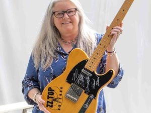 Hanson's music expert Claire Howell with the ZZ top guitar