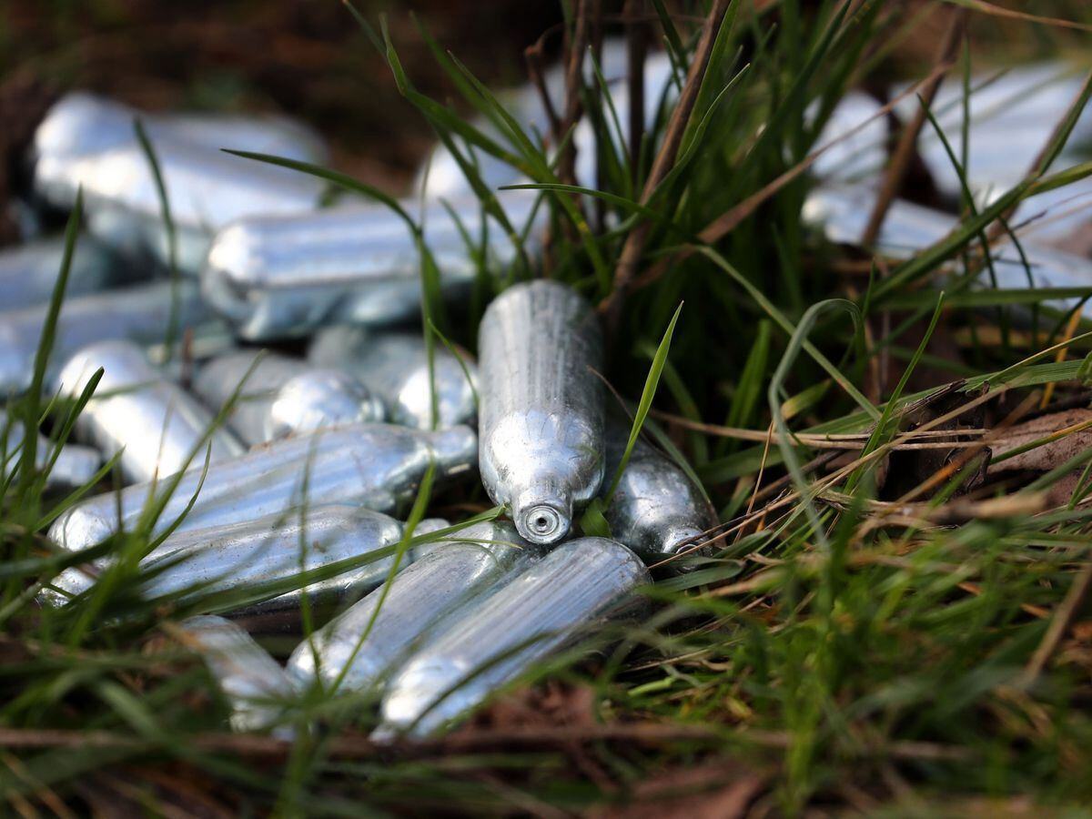 Discarded nitrous oxide canisters
