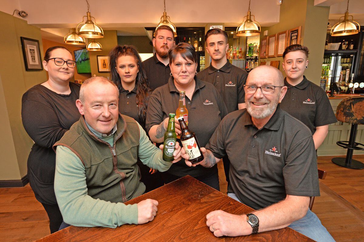 A Rugeley pub is re-opening after a two-and-a-half-year closure as The Cabin. Pictured front left: Derek Moore, Amanda Frisby and Grahame Frisby.
