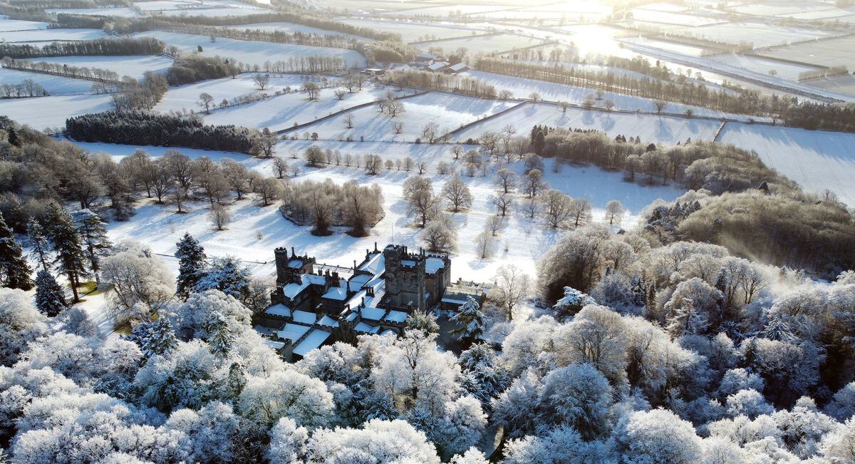 Freshly-fallen snow covers Beaufront Castle near Hexham in Northumberland on Tuesday