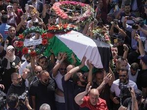 Family, friends and colleagues of slain Al Jazeera journalist Shireen Abu Akleh carry her coffin to a hospital in the east Jerusalem neighbourhood of Sheikh Jarrah, on Thursday, May 12,