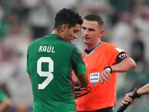 Match referee Michael Oliver shows his watch to Mexico's Raul Jimenez at full-time after the FIFA World Cup Group C match at the Lusail Stadium in Lusail, Qatar. Picture date: Wednesday November 30, 2022. PA Photo. See PA story WORLDCUP Saudi Arabia. Photo credit should read: Nick Potts/PA Wire...RESTRICTIONS: Use subject to restrictions. Editorial use only, no commercial use without prior consent from rights holder..