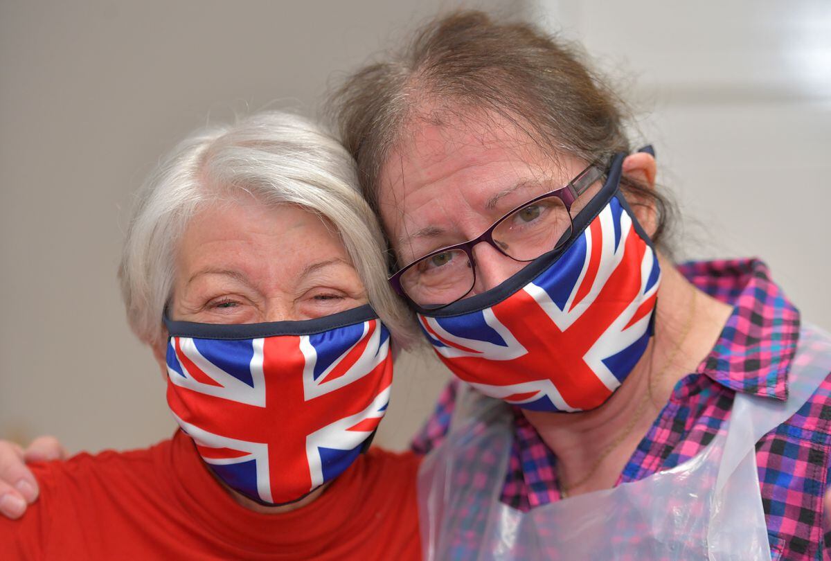 Oxygen operators Carol Keska and Sheila Scribner with their patriotic masks.