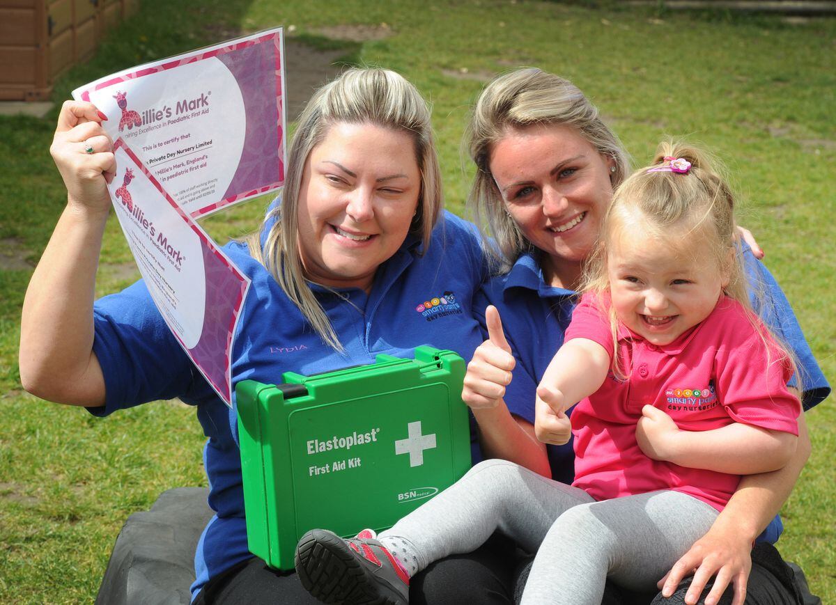 Happy to be awarded Milllie's Mark, (left-right) owner Lydia Browning, of Sedgley, room leader Chelsea Davies, of Dudley, with Macey-Drew Smith, aged 3, of West Bromwich, at Smarty Pants Day Nursery, Tipton.