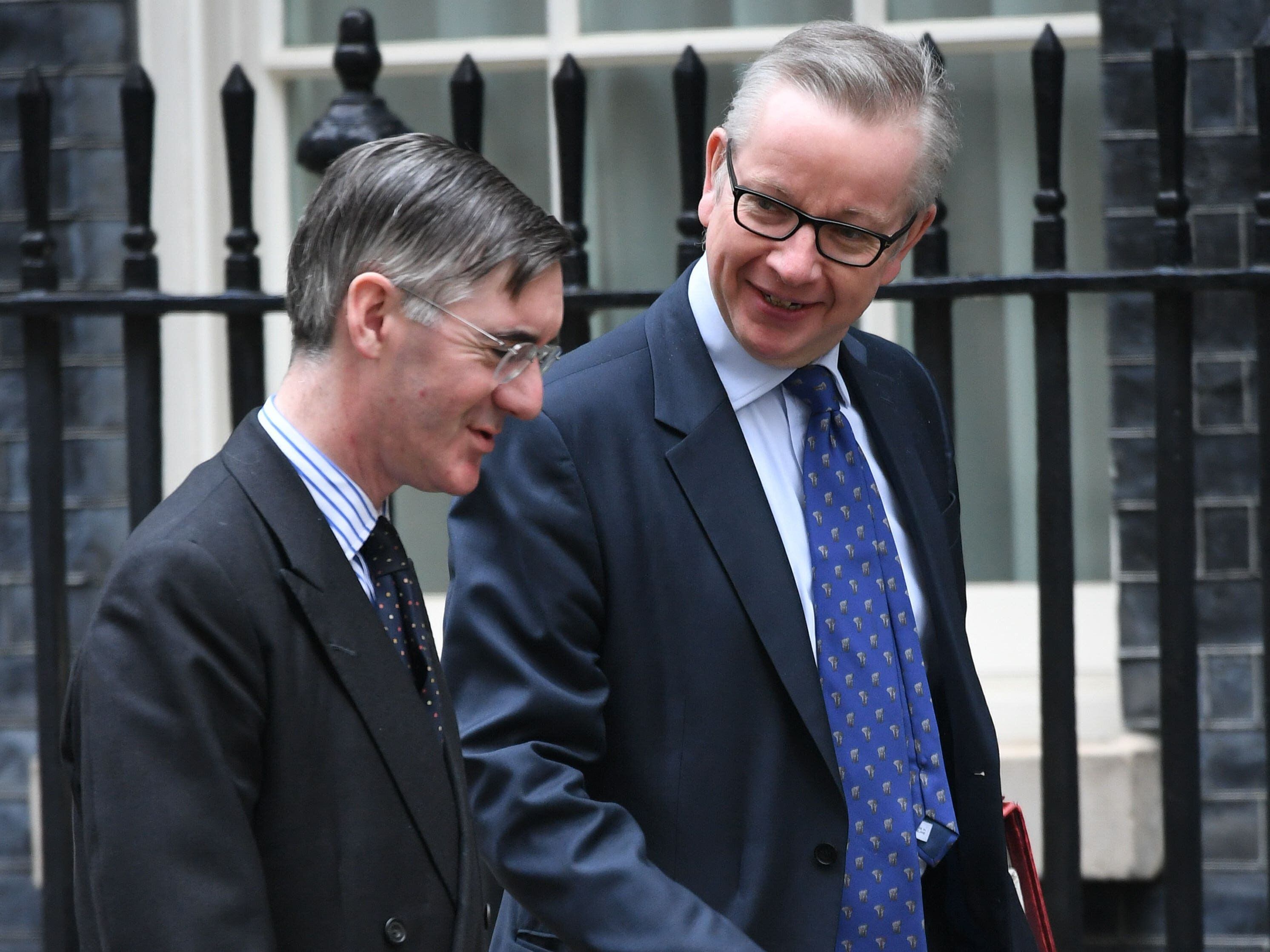 Michael Gove and Jacob Rees-Mogg trade polite blows across conference floor