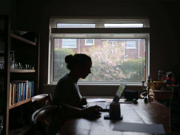 Silhouette of woman working from home