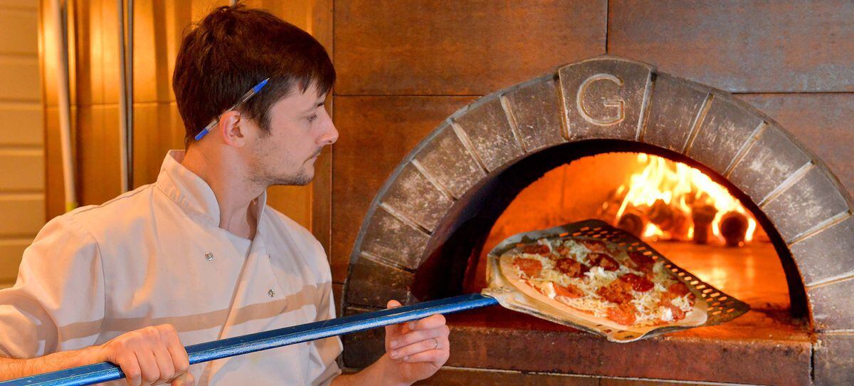 A pizza the action – chef Mark Bayliss gives this indulgent offering a blast in the wood-fired oven